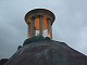 A lonely temple sits on top of a mountain.